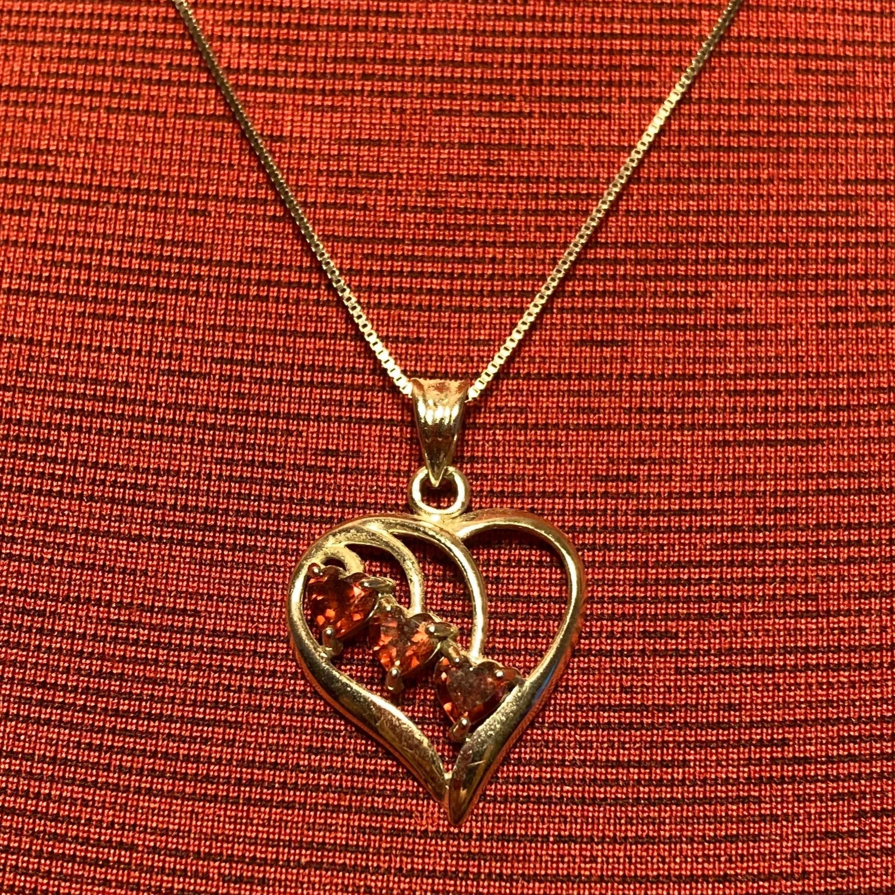 Vintage 14 karat white gold heart pendant with 3 heart shaped garnets and 20" chain from Italy