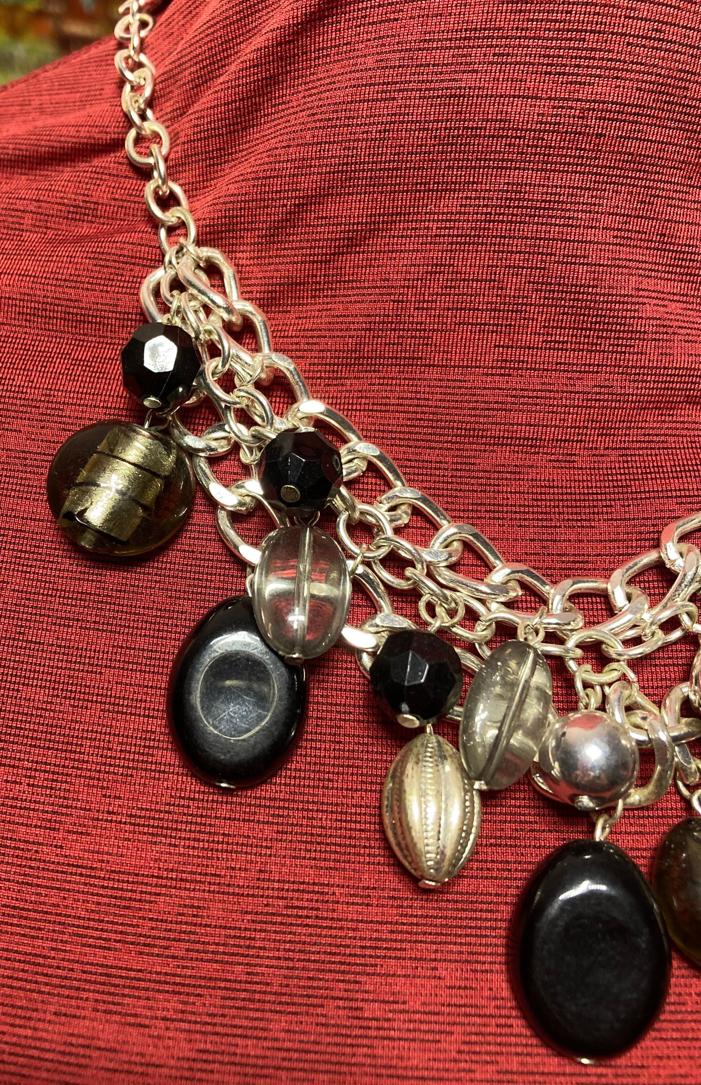 18 inch vintage dangling black beads. Silvertone curb chain links bib necklace.