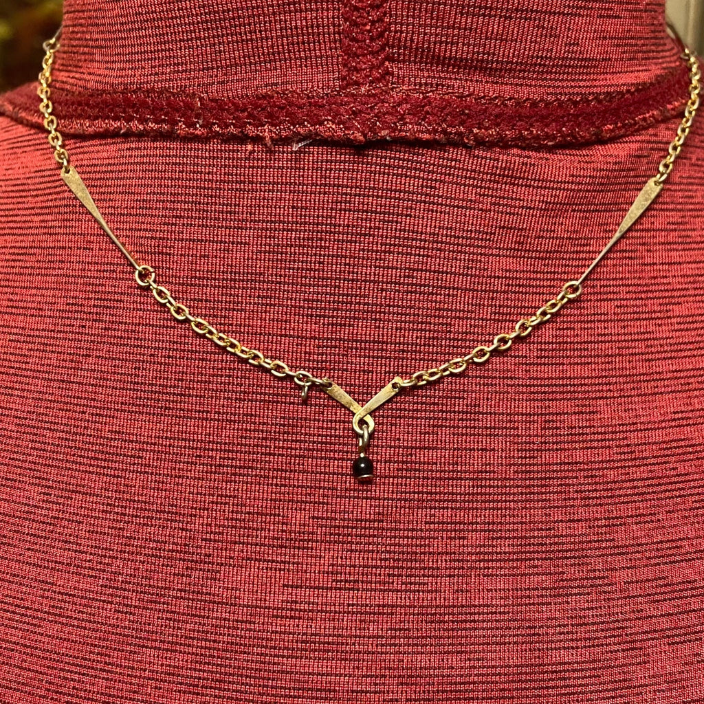 Vintage Avon, gold tone chain with twisted bar, vintage necklace and twisted bar pendant with hanging black bead 15 inch necklace