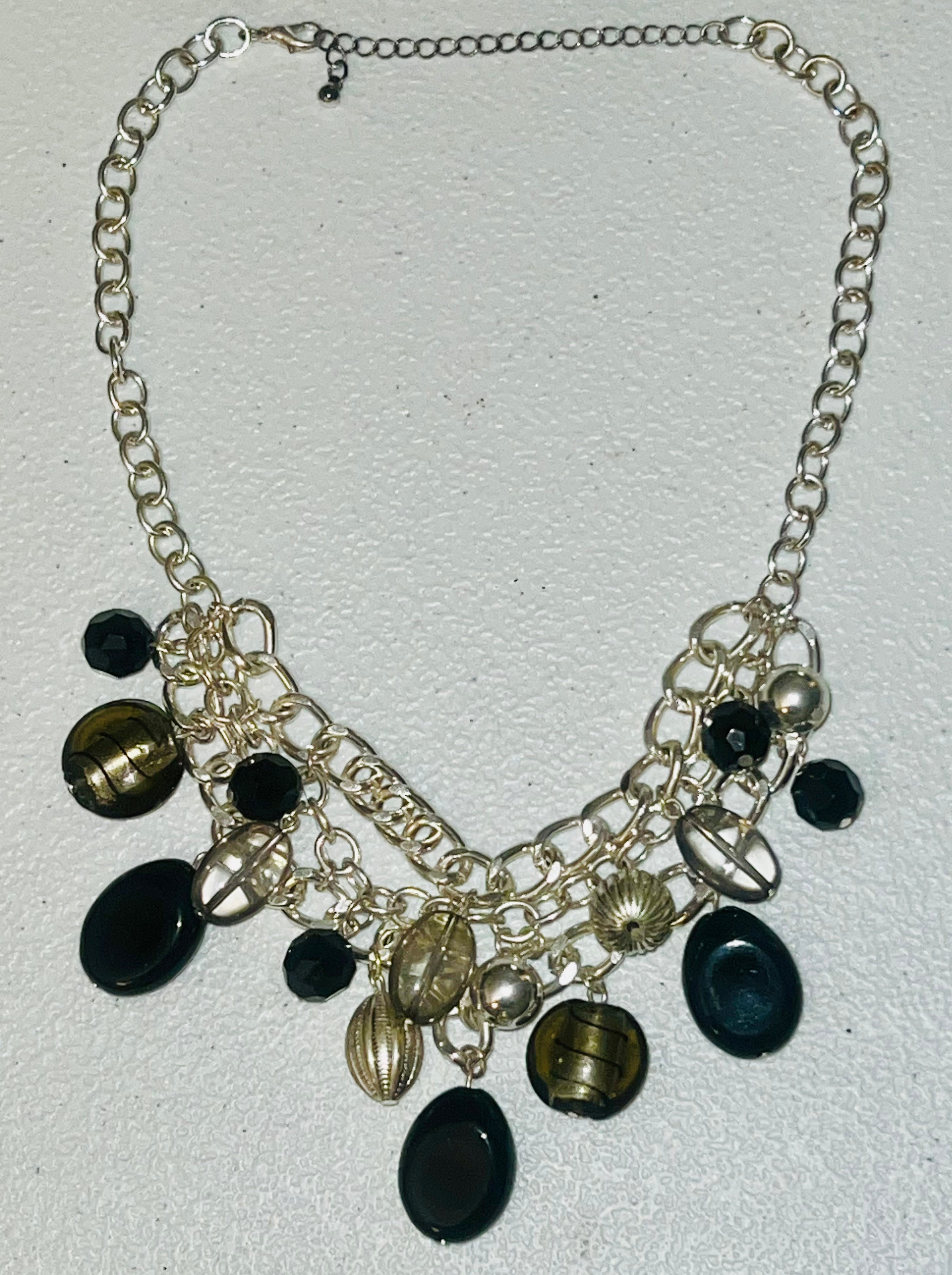 18 inch vintage dangling black beads. Silvertone curb chain links bib necklace.