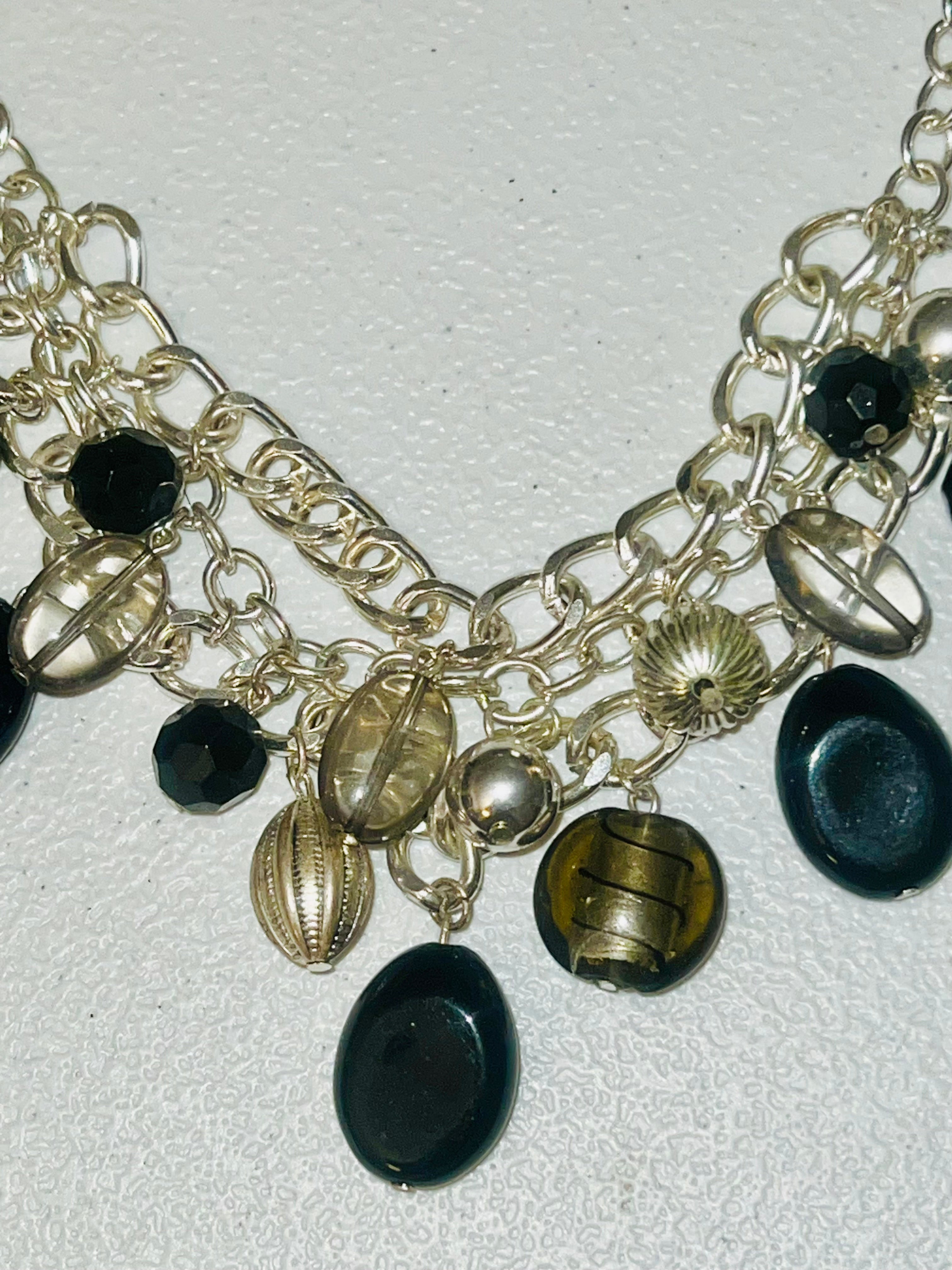 18 inch vintage dangling black beads. Silvertone curb chain links bib necklace.