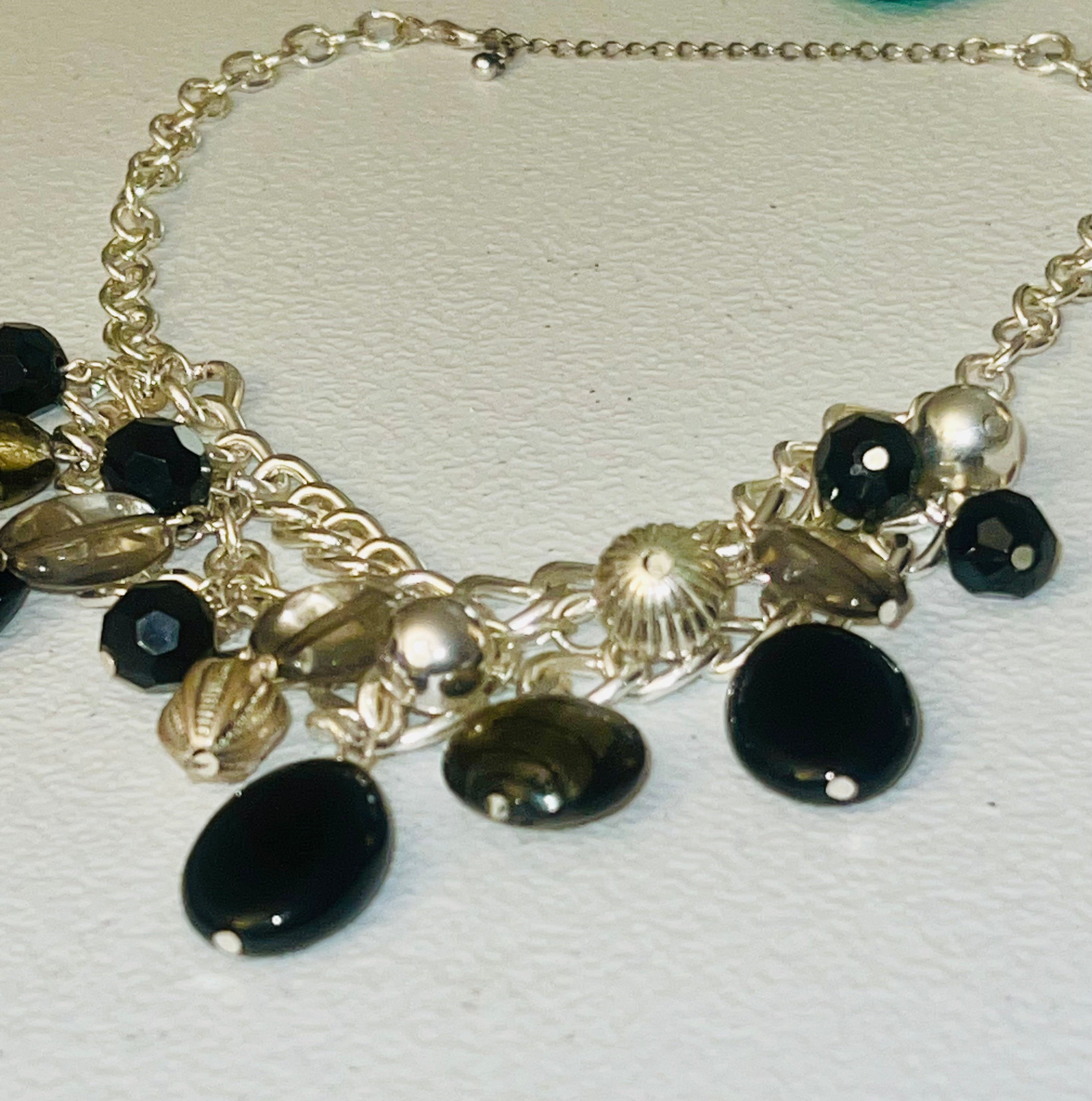 18 inch vintage dangling black beads. Silvertone curb chain links bib necklace.