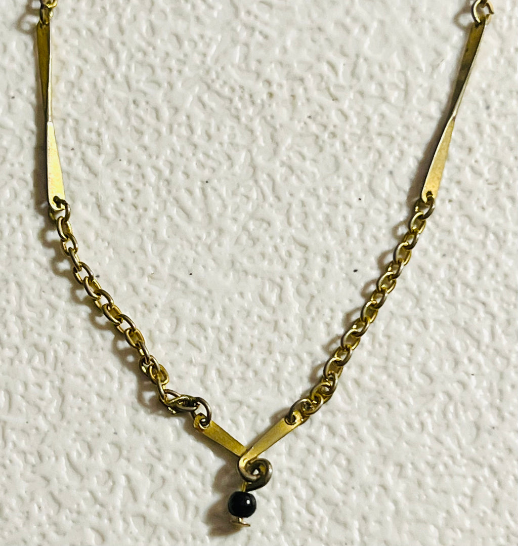 Vintage Avon, gold tone chain with twisted bar, vintage necklace and twisted bar pendant with hanging black bead 15 inch necklace